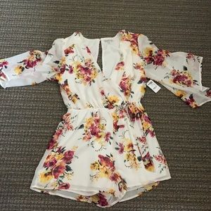Never worn tags still on Charlotte Russe romper